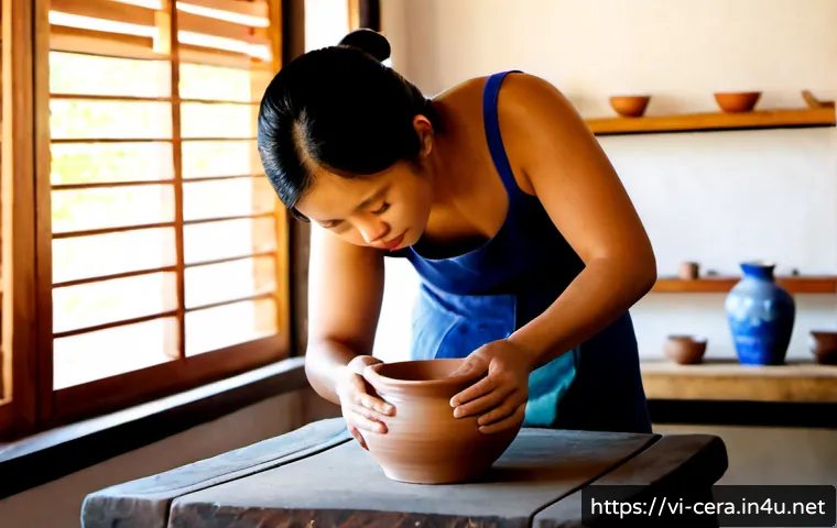 Home 17 미술세라믹 디자인 이론 - Photorealistic Vietnamese ceramic design studio, a skilled artisan shaping a smooth clay vase on a p...